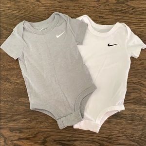 Pair of Nike Baby onesies. Size 9 months.
